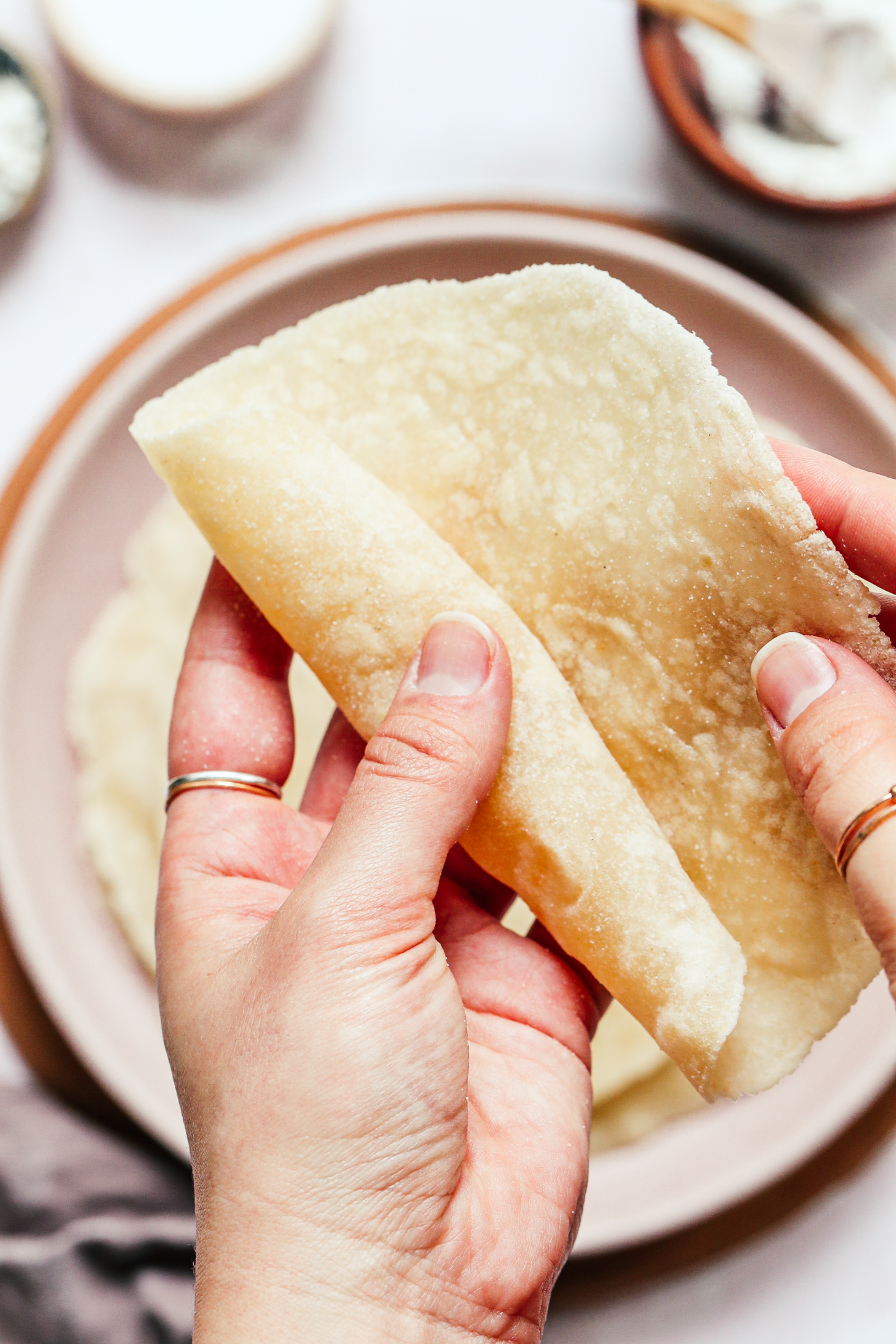 Rolling up a gluten-free flour tortilla made with cassava flour