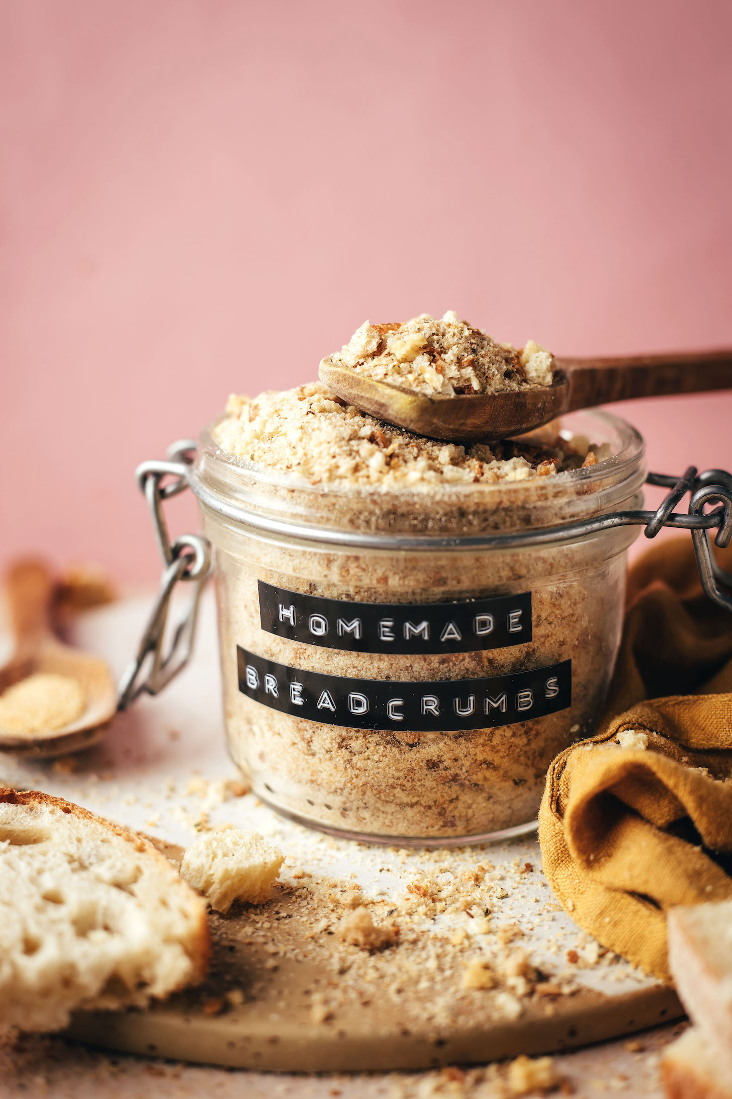 Jar and spoon of homemade breadcrumbs for our guide on how to make breadcrumbs
