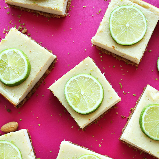 Creamy Vegan Lime Pie Bars on a hot pink background
