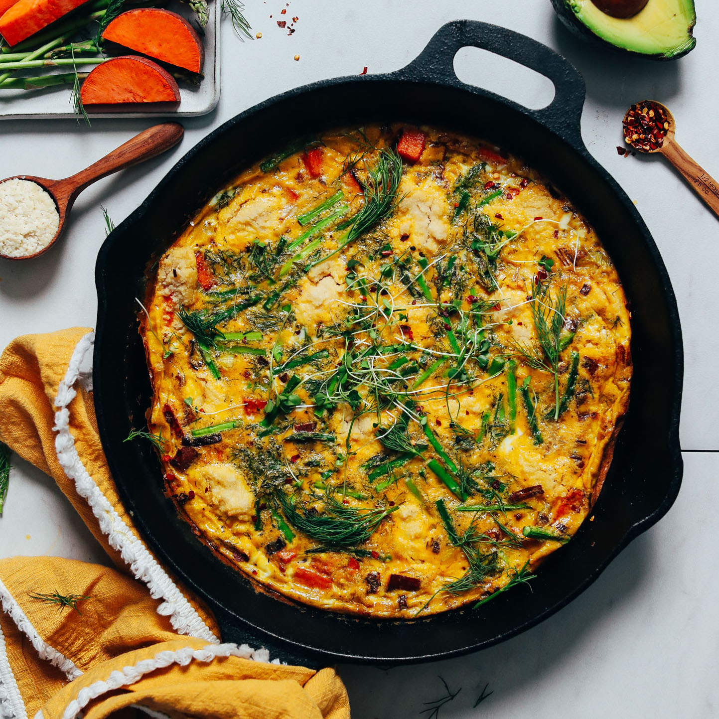 Cast iron skillet of Spring Vegetable Frittata made with asparagus
