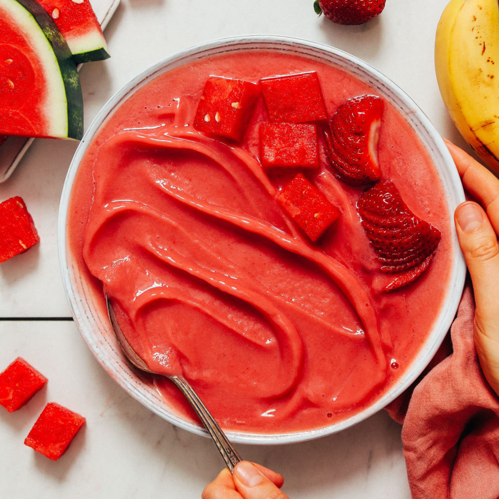 Using a spoon to create texture on a bowl of Strawberry Watermelon Sorbet
