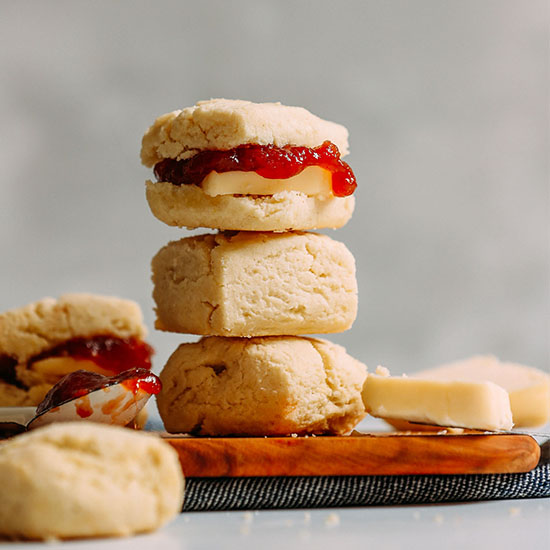 Spoonful of jam, slab of vegan butter, and stack of Vegan Gluten-Free Biscuits